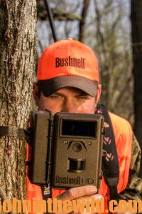 A hunter checks his trail cameras