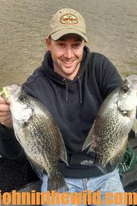 An angler shows off two crappie
