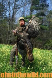 A hunter shows off his downed turkey