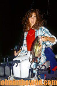 Catching a crappie during nighttime fishing