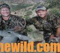 Chris Denham and a hunting friend with a fallen deer