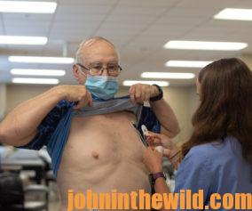 John E. Phillips being hooked up to a heart monitor