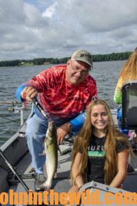 Two anglers pose with their fish