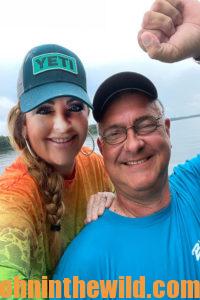 Amie Pollard and her husband Ron smile for a photo