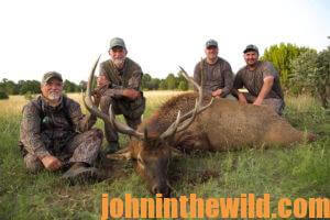 Group of hunters pose with their downed elk