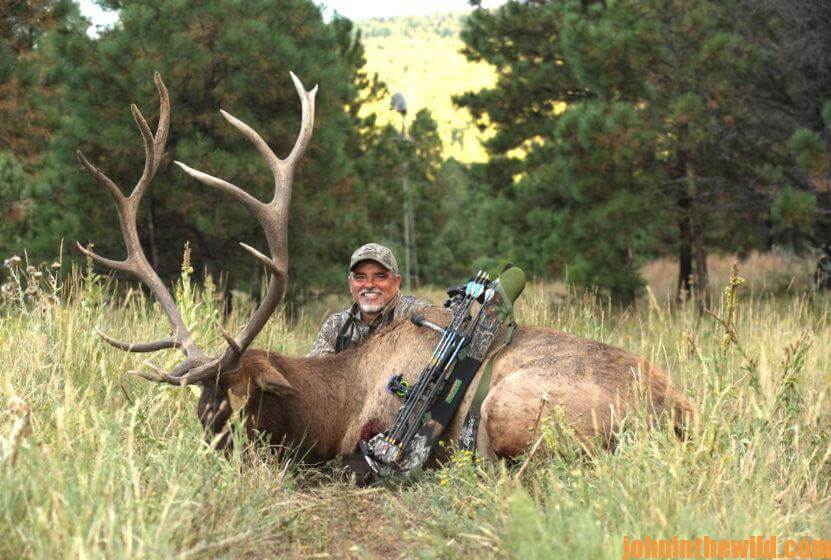 Hunter poses with his downed elk
