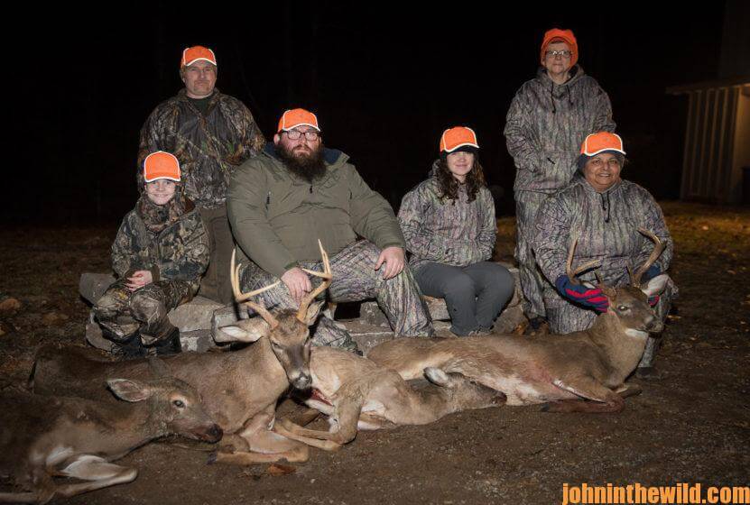 Group of hunters pose with 4 deer they've downed
