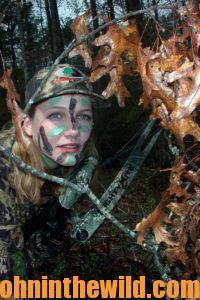 A hunter with her face painted