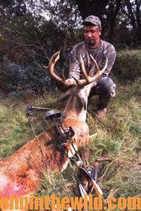 A hunter with a downed buck