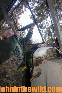 A hunter waits for a shot at a duck