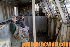 Some hunters waiting out in a duck blind for the next flock of ducks to pass