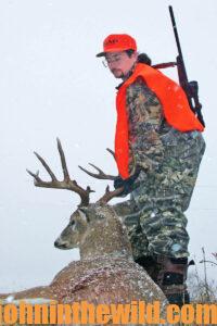 A hunter with his downed deer