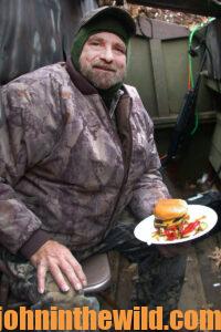 A happy hunter with a plate full of food