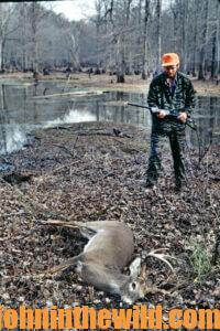 A hunter retrieves his downed deer