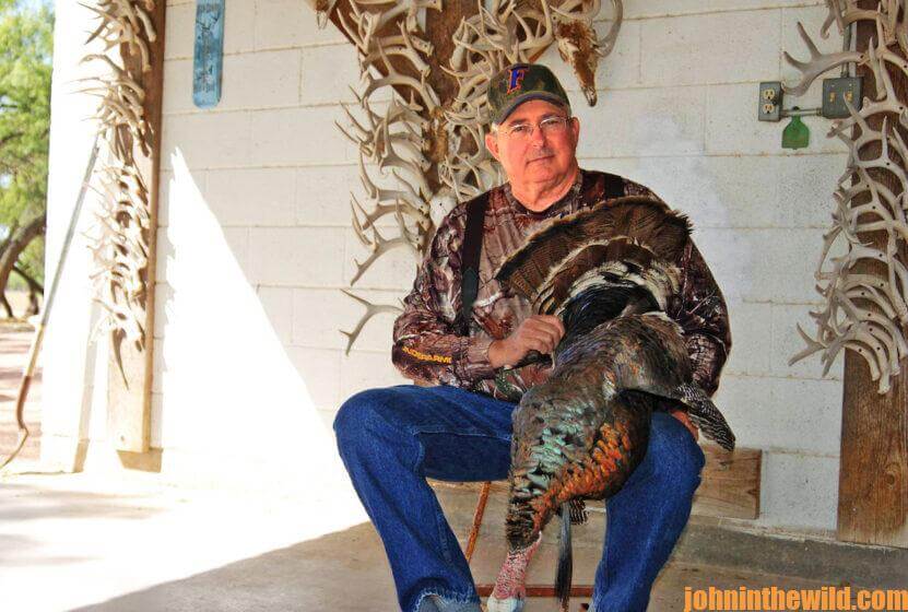 A hunter with his downed turkey