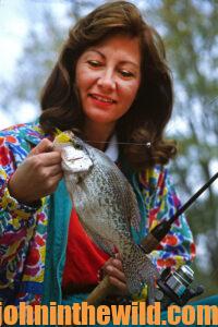An angler pulls in her catch