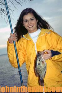 An angler shows off her fish