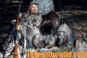 A turkey hunter with his downed bird