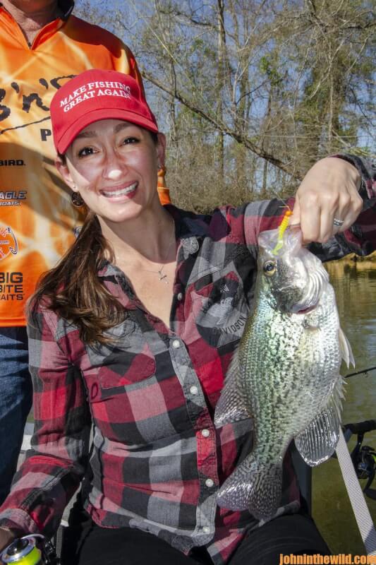 An angler shows off her fish