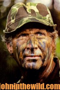 Up close headshot of a hunter in camo