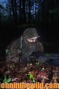 A hunter lies in wait for a gobbler to walk by