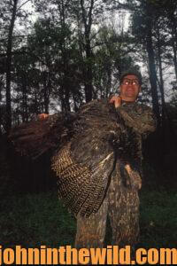 A hunter shows off his downed bird