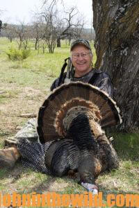 A hunter shows off his turkey