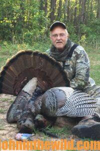 A hunter shows off his bird