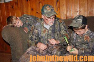 Three hunters check out some turkey calls