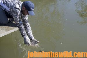 A fisherman releases his fish