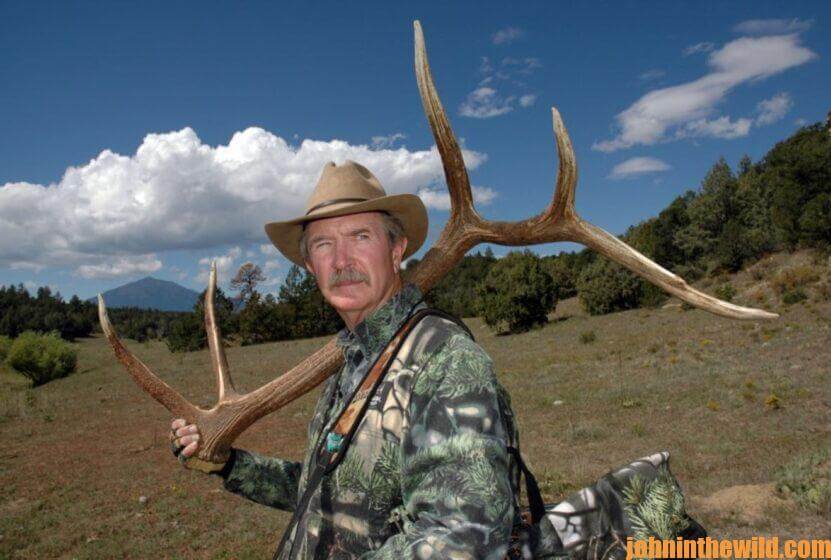 Elk hunter, Wayne Carlton, with elk antlers.