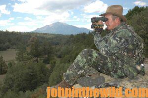 Elk hunter, Wayne Carlton, scouts out his hunting area.