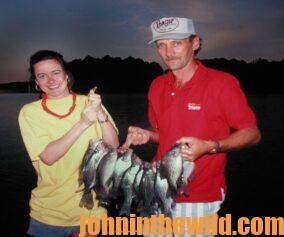 Fishermen posing with their limit of crappie