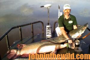 A bowfisherman shows off his fish