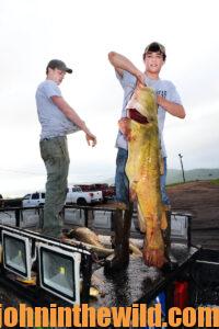 A bowfisherman shows off his catch