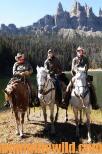 Karl Badger of Utah on horses with some hunting friends