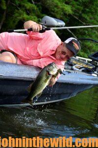 Captain Phillip Criss catching a bass