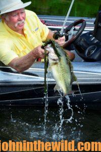 Captain Phillip Criss catching a bass