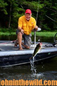 Captain Phillip Criss catching a bass