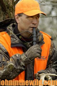 a hunter with a deer call