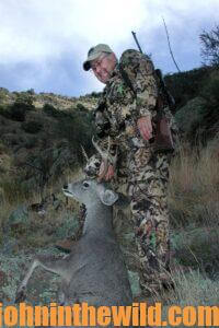 Chris Denham with a fallen deer