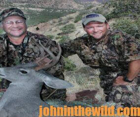 Chris Denham and a hunting friend with a fallen deer