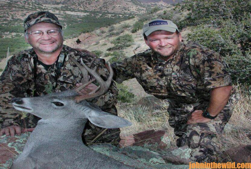 Chris Denham and a hunting friend with a fallen deer