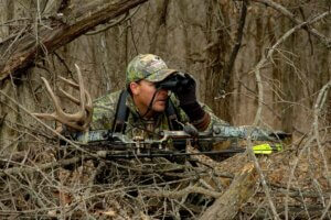 Rifle deer hunter in the woods