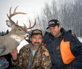 Deer hunters with their trophies