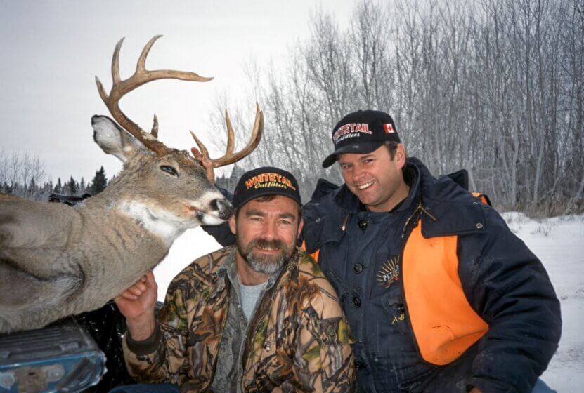 Deer hunters with their trophies