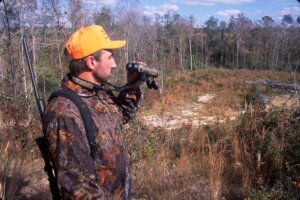 Deer hunter with his binoculars