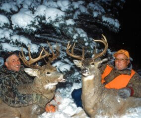 Deer hunters with their trophies