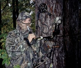A hunter calling his buck