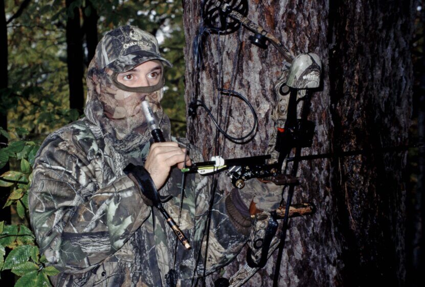 A hunter calling his buck